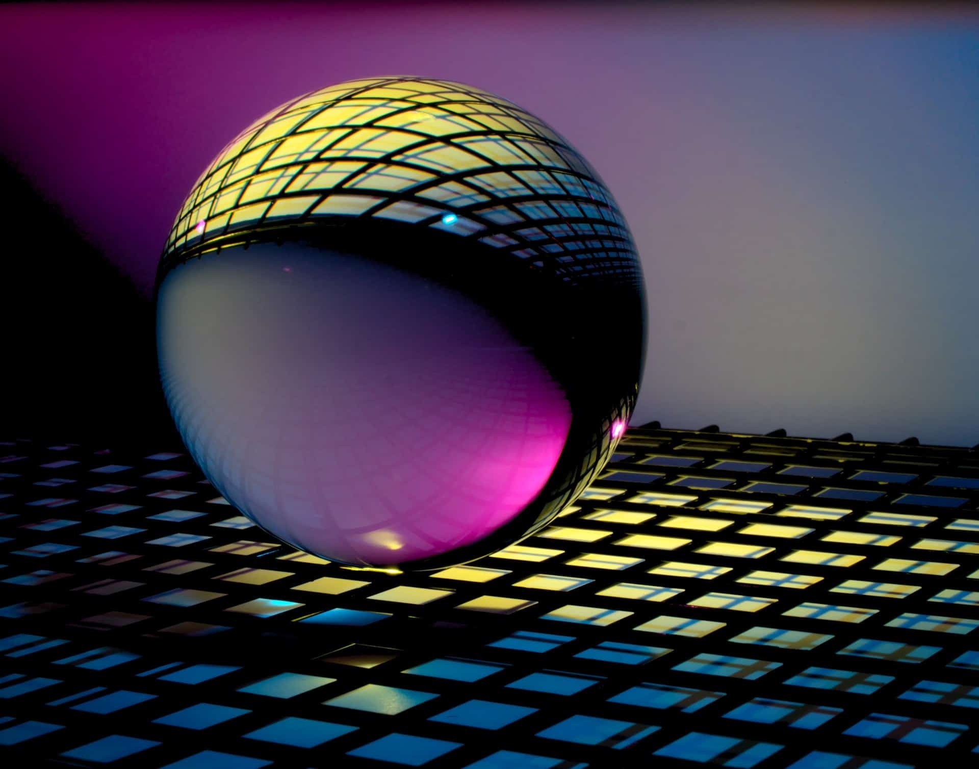 A colorful sphere sitting on top of a tiled floor.
