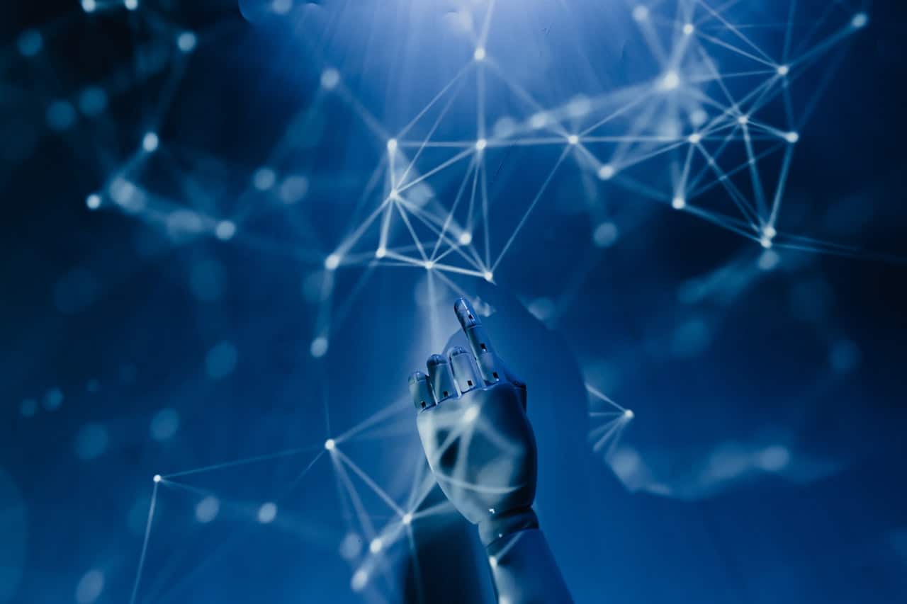 A blue background with a hand reaching out to something.